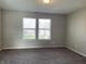 Spacious bedroom with neutral walls and plush carpeting at 7530 Redcliff Rd, Indianapolis, IN 46256