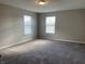 Spacious bedroom with neutral walls and plush carpeting at 7530 Redcliff Rd, Indianapolis, IN 46256
