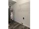 Bright laundry room with washer and dryer hookups, and ample shelving at 7530 Redcliff Rd, Indianapolis, IN 46256