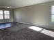 Living room featuring neutral walls and gray carpeting at 7530 Redcliff Rd, Indianapolis, IN 46256