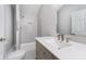 Modern bathroom with a large walk-in shower and updated vanity at 1423 Hoyt Ave, Indianapolis, IN 46203