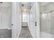 Modern bathroom with a shower and barn door at 1423 Hoyt Ave, Indianapolis, IN 46203