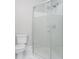 Clean bathroom with a corner shower and white toilet at 1423 Hoyt Ave, Indianapolis, IN 46203