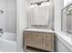 Modern bathroom with wood vanity and large mirror at 1423 Hoyt Ave, Indianapolis, IN 46203