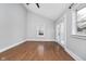 Bright bedroom with hardwood floors, French doors, and a ceiling fan at 1423 Hoyt Ave, Indianapolis, IN 46203