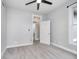Spacious bedroom with neutral walls, ceiling fan, and carpet at 1423 Hoyt Ave, Indianapolis, IN 46203