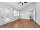 Large bedroom featuring hardwood floors, French doors, and access to a full bathroom at 1423 Hoyt Ave, Indianapolis, IN 46203