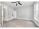 Spacious bedroom with carpet, neutral walls, and access to bathroom at 1423 Hoyt Ave, Indianapolis, IN 46203
