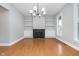 Bright dining room with hardwood floors, chandelier, and fireplace at 1423 Hoyt Ave, Indianapolis, IN 46203