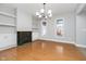 Spacious dining room with hardwood floors and a view to the kitchen at 1423 Hoyt Ave, Indianapolis, IN 46203