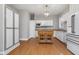 Modern kitchen with white cabinets, wood island, and stainless steel appliances at 1423 Hoyt Ave, Indianapolis, IN 46203