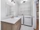 Convenient laundry room with washer, dryer, and a light wood vanity at 1423 Hoyt Ave, Indianapolis, IN 46203