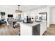 Modern kitchen with white cabinets, island, and stainless steel appliances at 1814 Vista Ridge Dr, Greenwood, IN 46143