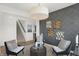 Sitting room with gray walls, four chairs, and a large light fixture at 1814 Vista Ridge Dr, Greenwood, IN 46143