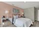 Cozy bedroom with a blush pink wall and stylish decor at 1829 Grand Vista Blvd, Greenwood, IN 46143