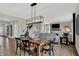 Bright dining room features a rustic wooden table and modern chandelier at 1829 Grand Vista Blvd, Greenwood, IN 46143
