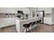 Bright kitchen boasts white cabinets, island with seating, and stainless steel appliances at 1829 Grand Vista Blvd, Greenwood, IN 46143