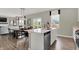 Open kitchen features island, stainless steel appliances, and view to dining area at 1829 Grand Vista Blvd, Greenwood, IN 46143