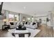 Open living room with hardwood floors and a view into the kitchen at 1829 Grand Vista Blvd, Greenwood, IN 46143