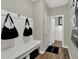Convenient mudroom with built-in bench and hooks for bags at 1829 Grand Vista Blvd, Greenwood, IN 46143