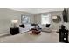 Upstairs sitting area with L-shaped sofa and wood coffee table at 1829 Grand Vista Blvd, Greenwood, IN 46143