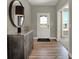 Elegant entryway with wood floors, a console table, and mirror at 1836 Vista Ridge Dr, Greenwood, IN 46143