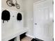 Functional mudroom with bench seating and hooks for backpacks at 1841 Grand Vista Blvd, Greenwood, IN 46143