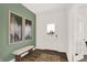 Bright entryway with wood floors, bench, and view to the dining room at 1895 Grand Vista Blvd, Greenwood, IN 46143