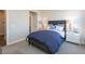 Cozy bedroom with navy blue bedding and patterned wallpaper at 3618 Planck Cir, Danville, IN 46122