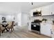 Modern kitchen with stainless steel appliances and white shaker cabinets at 3666 N Mitchner Ave, Indianapolis, IN 46226