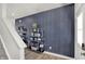 Foyer with geometric wallpaper and modern shelving unit at 4556 Nokes Pl, Indianapolis, IN 46235