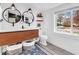 Modern bathroom with double vanity, large mirrors, and a window with natural light at 4952 Kingsley Dr, Indianapolis, IN 46205