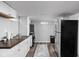 Basement kitchenette with white cabinets and appliances at 5114 Hillside Ave, Indianapolis, IN 46205