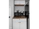 Small kitchen counter with microwave, coffee maker, and storage at 5114 Hillside Ave, Indianapolis, IN 46205