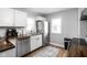 Modern kitchen with white cabinets, stainless steel appliances, and butcher block counters at 5114 Hillside Ave, Indianapolis, IN 46205