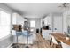 Open concept kitchen with island and dining area at 5114 Hillside Ave, Indianapolis, IN 46205