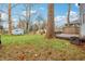 Large backyard with deck, shed, and mature trees at 5140 Winthrop Ave, Indianapolis, IN 46205