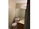 Simple bathroom with single vanity, toilet, and large mirror at 636 Creston Point Cir, Indianapolis, IN 46239