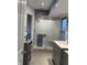 Modern bathroom with glass shower, marble vanity top, and updated fixtures at 636 Creston Point Cir, Indianapolis, IN 46239