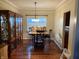 Dining area with hardwood floors, a table, and display cabinets at 636 Creston Point Cir, Indianapolis, IN 46239