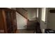 Entryway with carpeted stairs, tiled floor, and wooden cabinet at 636 Creston Point Cir, Indianapolis, IN 46239