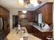 Kitchen featuring granite countertops, ample cabinetry, and an island with double sink at 636 Creston Point Cir, Indianapolis, IN 46239