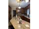 Kitchen with an island, granite countertops, and plenty of storage space at 636 Creston Point Cir, Indianapolis, IN 46239