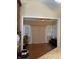 Sunroom or den with blinds, sliding door, and wood flooring at 636 Creston Point Cir, Indianapolis, IN 46239