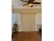 Bright sunroom with sliding doors, blinds, and hardwood flooring at 636 Creston Point Cir, Indianapolis, IN 46239