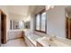 Primary bathroom with double vanity and soaking tub at 9699 Prairiewood Way, Carmel, IN 46032