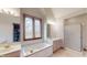 Primary bathroom with soaking tub and separate shower at 9699 Prairiewood Way, Carmel, IN 46032