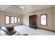 Large bedroom with neutral walls and plush carpeting at 9699 Prairiewood Way, Carmel, IN 46032