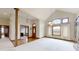 Two-story entryway with hardwood floors and an open floor plan at 9699 Prairiewood Way, Carmel, IN 46032