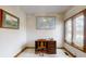 Home office with built-in desk and window views at 9699 Prairiewood Way, Carmel, IN 46032